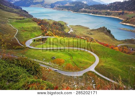 Mountains And Lake Roselend  With A Dike