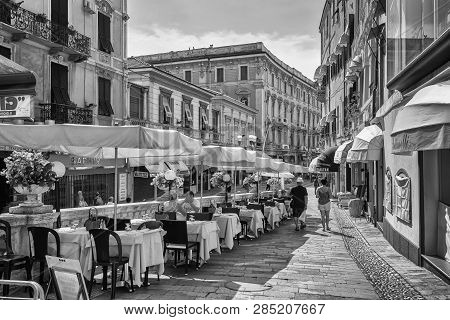 San Remo, Italy, September 18, 2018:  Black And White Photo Of The Outside Terrace Of A Restaurant O