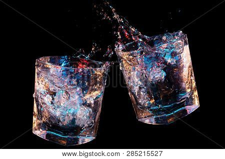 Rocks Glasses Toasting And Splashing Clear Liquid