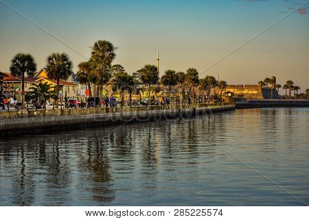 St. Augustine, Florida. January 26, 2019. People Walking In Boardwalk On Sunset Background At Old To
