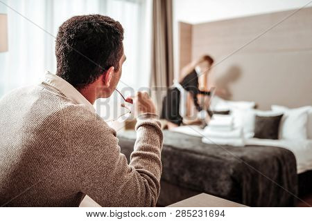 Businessman Having Plans For Harassment Looking At Sexy Maid