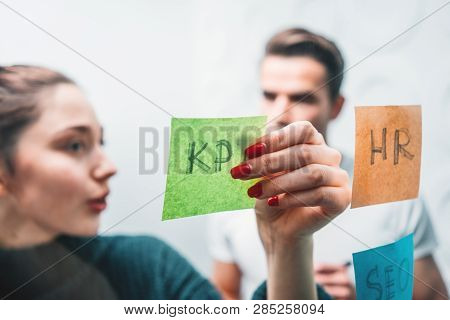 Portrait Of Coworker People Standing At Office Space Behind Glass Wall With Sticky Notes. Team Of Ma