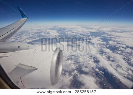 View Of Beautiful Cloud And Wing Of Airplane From Window