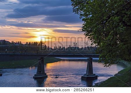 Sunset Over Uzh River In Uzhhorod City, Transcarpathia, Ukraine. Beautiful Cityscape Of Old European