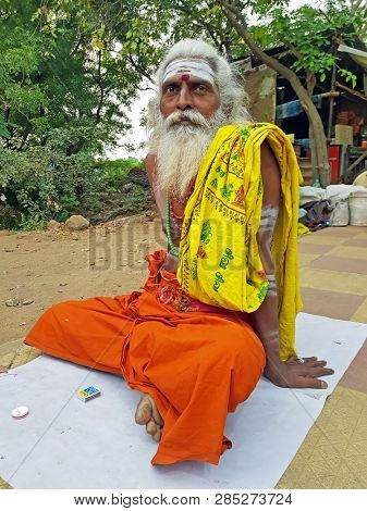 Tiruvanamalai, India - January 5, 2019:  Indian sadhu in the streets from Tiruvanamalai in India