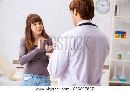 Deaf-mute female patient visiting young male doctor 