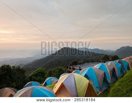 Adventures Camping Tourism And Tent ,view Forest Landscape , Outdoor In Morning And Sunset Sky At Mo