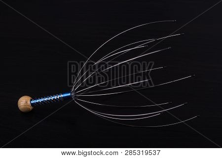 Device For Head Massage. Black Background. Orgasm. Relaxation.