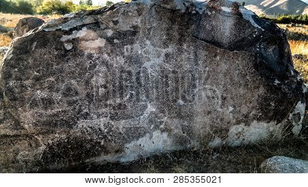 Rock Painting Aka Petroglypgs At The Field , Cholpon-ata, Issyk-kul, Kyrgyzstan