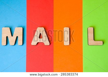 Word Mail Of Large Wooden Letters On Colored Background Of 4 Colors, Popular In Logos Of Digital Or 
