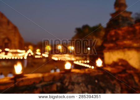 Blurry Candlelight Procession On Buddhist Day At Mahaeyong Temple In Thailand