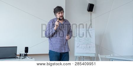Professor With Beard And Mustache Screensaver Web Page. Male, Teacher Warning. Teacher In Casual Clo
