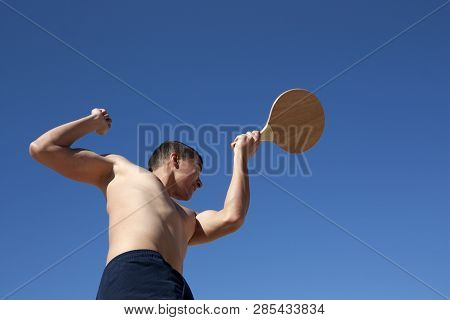 The Guy Plays Matkot On The Beach