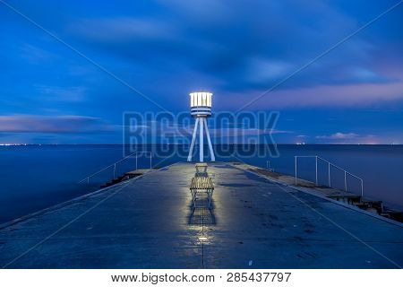 Klampenborg, Denmark - March 25, 2017: Illuminated Lifeguard Tower At Bellevue Beach At Night