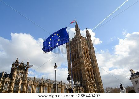 E.u. Flag Flying In Front Of Union Ack Flag At Houses Of Parliament London