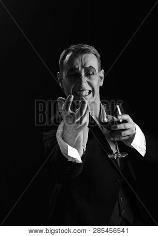 Hate. Comedian With Mime Makeup Hold Wine Glass. Mime Man. Mime Artist Perform On Stage. Stage Actor