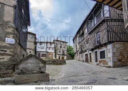 Alberca, Salamanca, Spain; June 2015: Fountain  And Buildings Of The Medieval Village Of La Alberca 