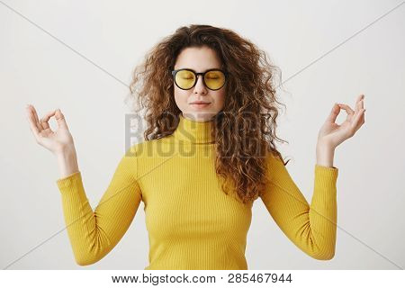 Portrait Calm Woman Smiling Doing Yoga Exercises Relaxing On White Blank Studio Wall, Happy Young Gi