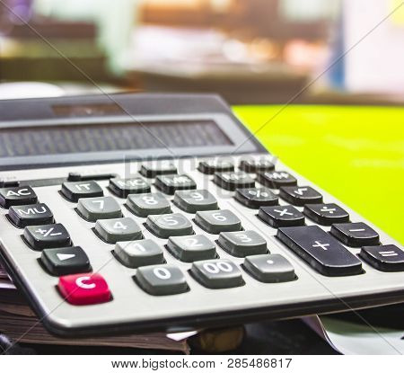 Close Up Button Calculator , Calculator On Paper Messy And Cluttered Office Desk