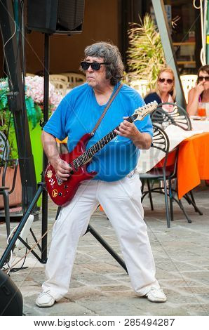 Pisa, Italy. June 16, 2015. An Electric Guitar Player Performing On The Streets Of Pisa, On The Day 
