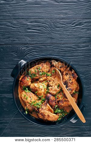 Overhead View Of Kuku Paka, Kenyan Chargrilled Chicken In Creamy Spicy Coconut Sauce In A Earthenwar