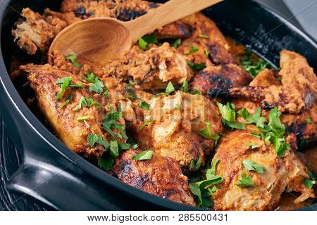 Overhead View Of Kuku Paka, Kenyan Chargrilled Chicken In Creamy Spicy Coconut Gravy In A Earthenwar