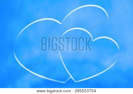 Drawn Hearts In Blue Sky At Clear Day. Natural Background With Painted Hearts With Cloudy Texture In