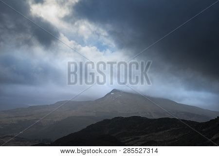 Dark And Dramatic Winter Landscape Image Of Moel Saibod From Crimpiau In Snowdonia With Stunning Sha