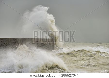 Stunning Waves Crashing Over Harbor Wall During Windy Storm At Newhaven On English Coast