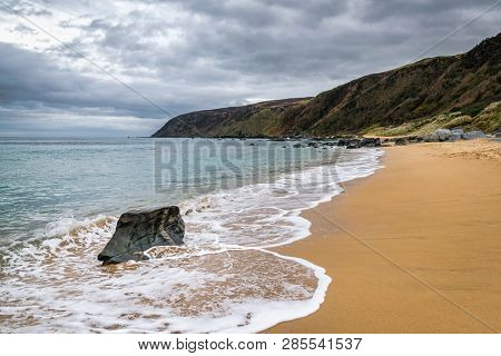 This Is A Picture Of The Sandy Beach At Kinnagoe Bay In Doengal Ireland