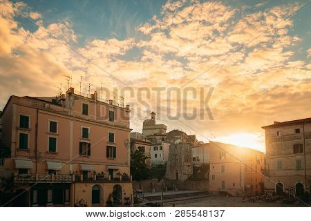 Terracina, Italy. Piazza Municipio And View Of Castle Castello Frangipane In Upper Town In Sunset Su