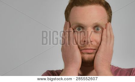 Close Up Portrait Attractive Man Showing Emotion Surprise. Handsome Student With Red Hair And Blue E