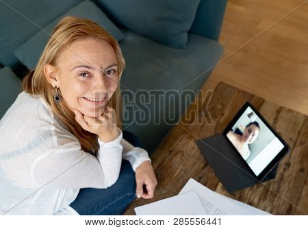 Beautiful Freelance Woman Consultant Having A Video Conference Call With Online Client At Home