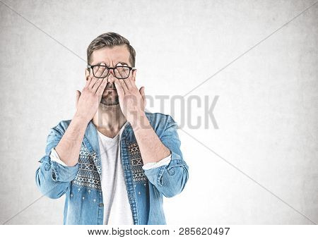 Casual Man Covering Eyes With Hands, Concrete