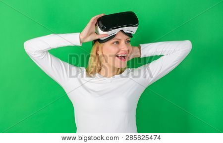 Woman Using Vr Device. Pretty Woman Playing Game In Virtual Reality Glasses. Beautiful Woman Wearing