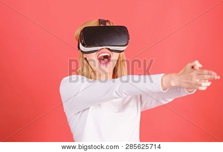 Woman Using Virtual Reality Headset. Happy Young Woman Wearing Virtual Reality Goggles Watching Movi