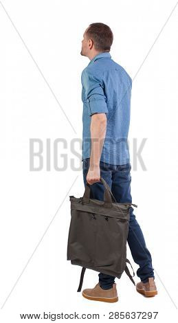 Back view of a man with a green bag.  backside view of person.  Rear view people collection. Isolated over white background. The guy in the blue shirt with a backpack in his hand looks sideways.