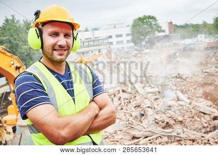 Demolition construction work. Worker at building site