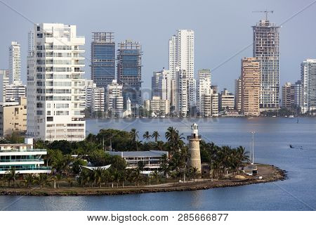 The Morning View Of A Lighthouse With Bocagrande District Skyline In A Background (cartagena, Colomb