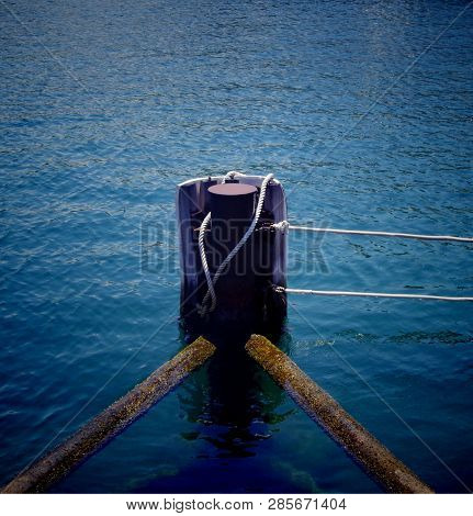 Safe Anchoring With Ropes On Blue Sea