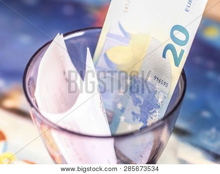 Moscow, Russia - February 20, 2018: The image of tips in a glass in Moscow restaurant