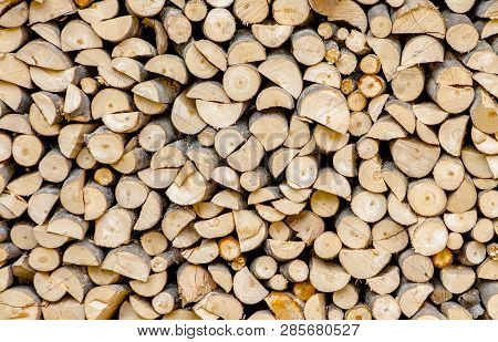 Material For Heating The House. Preparation Of Firewood For The Winter. Background Of Firewood. A Pi