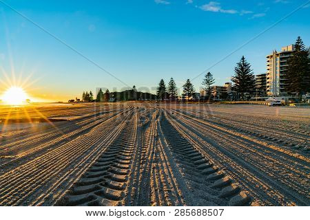 Intense Sunrise At Mount Maunganui Back Lights Landscape Main Beach, Tauranga New Zealand.