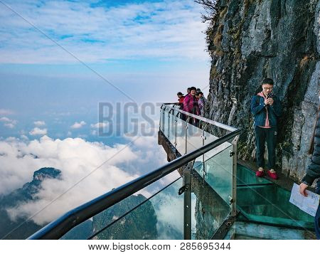 Zhangjiajie/china - 15 October 2018:unacquainted Tourists On Glass Cliff Walk In Tianmen Mountain At