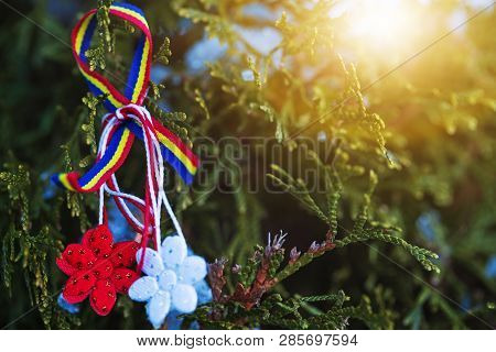 Beautiful Martisor In Red And White String With Hanging Tassel. Martisor Is Romanian Or Moldavian Tr
