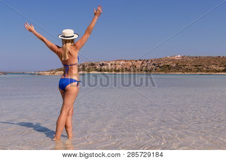 Free Happy Woman Raising Arms And Enjoying Beach Relaxing Joyful In Summer By Tropical Blue Water. B