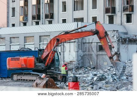 Cleaning Of Construction Debris With A Bucket Of An Excavator/ Building Demolition Excavator, Heavy 
