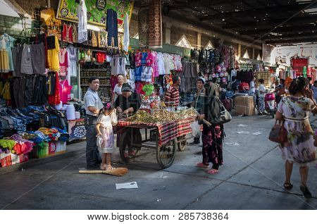 Turpan, China - August 10, 2012: People At A Street Market In The City Of Turpan, Xinjiang Region.