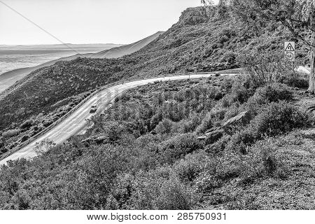 Nieuwoudtsville, South Africa, August 29, 2018: Vehicles Are Visible On The Historic Van Rhyns Pass 