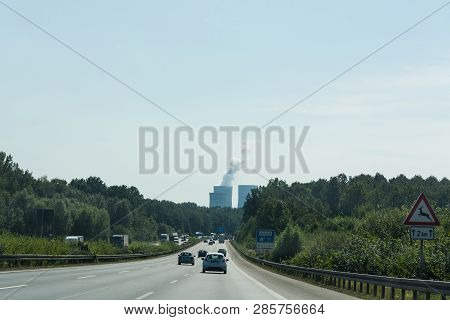 Unna, Germany - August 23, 2017: Traffic On The A2 Motorway And Scholven Coal Power Station, Germany